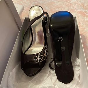 Tevolio black heels. Never worn but tried on.